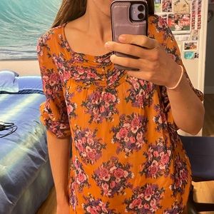 Large orange floral blouse